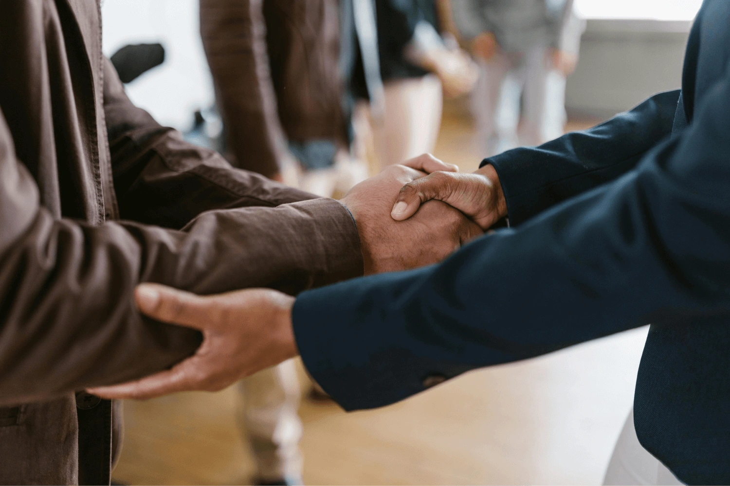 Two men in suit shaking hands