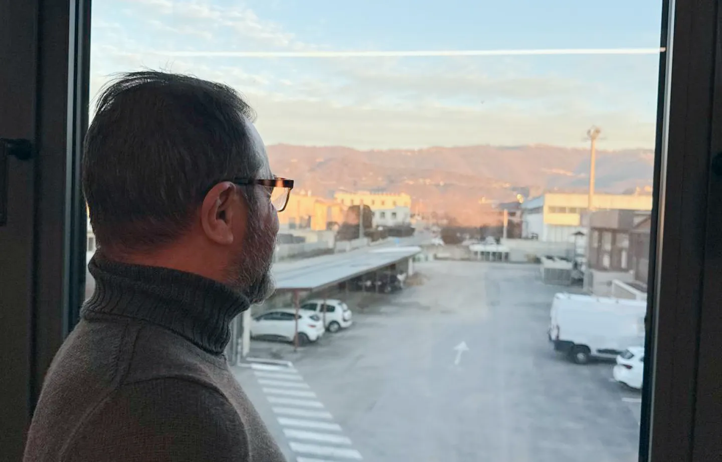 A man looking out the window